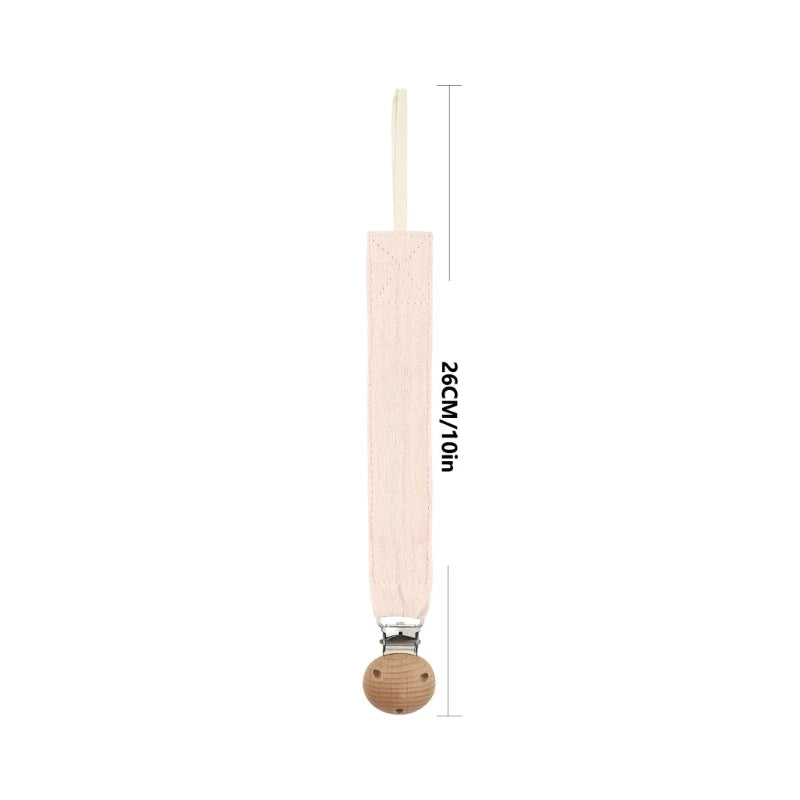 Attache-tétine en coton avec clip en bois, présentée sur fond blanc avec indication de la longueur totale de 26 cm.