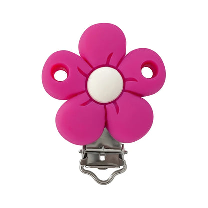 Clip attache-tétine en silicone en forme de fleur fuchsia avec centre blanc et mécanisme métal, pour création personnalisée.