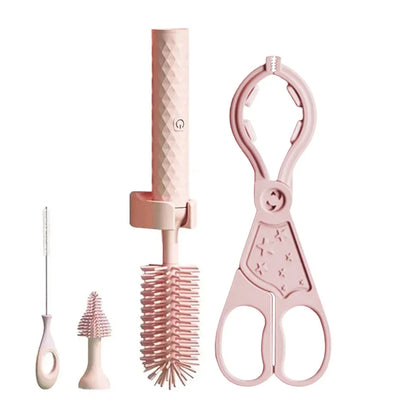Kit brosse électrique rose pour biberons et bouteilles comprenant brosse principale en silicone, tête interchangeable, goupillon fin et pince multifonction.