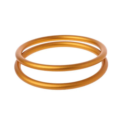 Lot de deux anneaux en aluminium couleur or pour porte-bébé, vue latérale