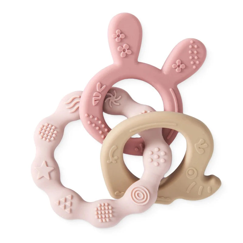 Anneaux de dentition pour bébé en silicone alimentaire rose et beige, formes animales texturées pour le massage des gencives