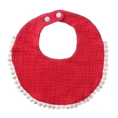 Bavoir bébé en coton mousseline rouge vif avec bordure pompons et fermeture par boutons-pression